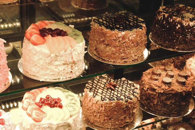 Board with delicious cake on table