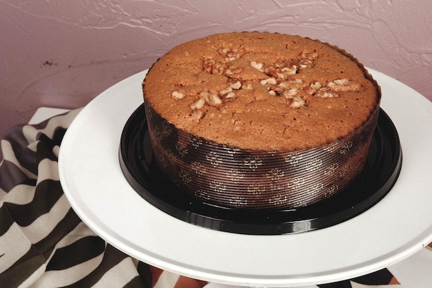 Board with delicious cake on table