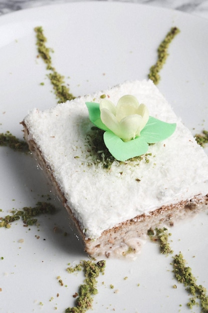 Board with delicious cake on table