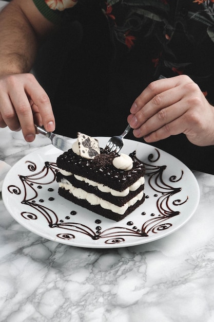 Board with delicious cake on table