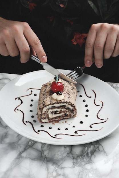 Board with delicious cake on table