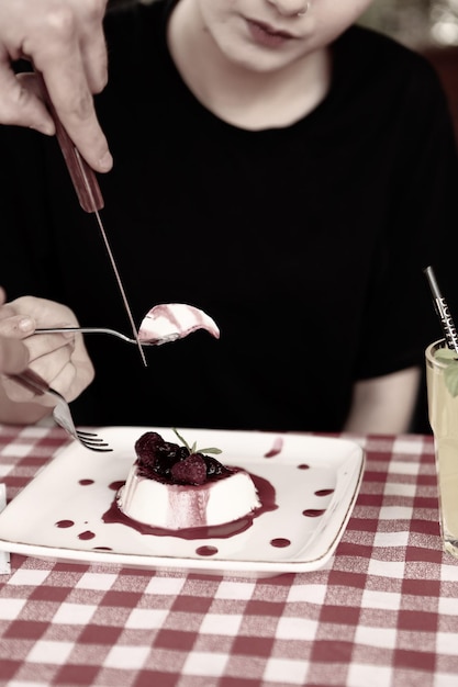 Board with delicious cake on table