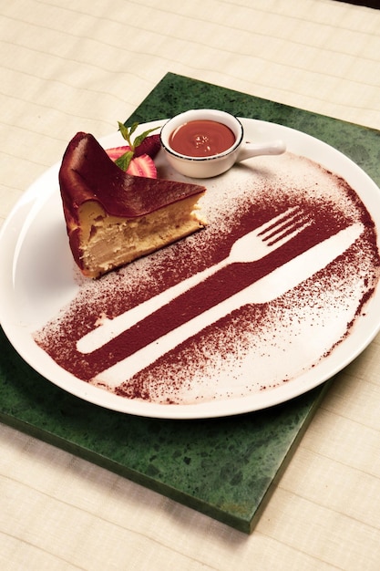 Board with delicious cake on table