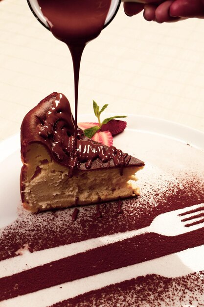 Board with delicious cake on table