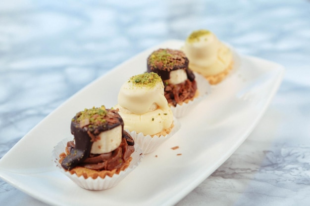 Board with delicious cake on table