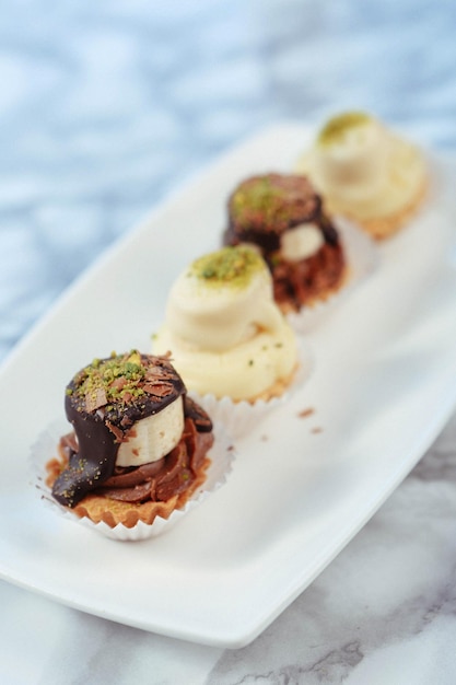 Board with delicious cake on table