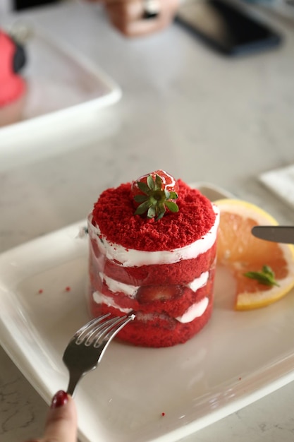 Board with delicious cake on table