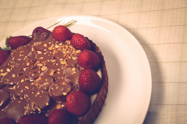 Board with delicious cake on table