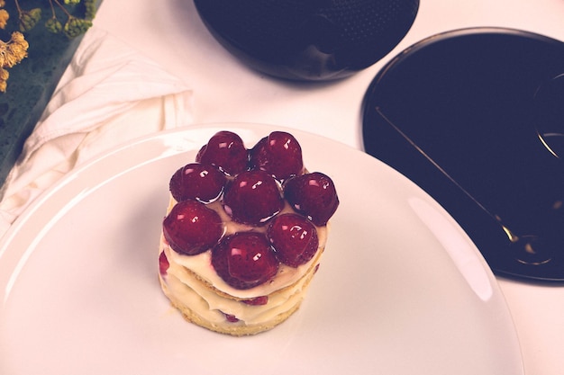 Board with delicious cake on table