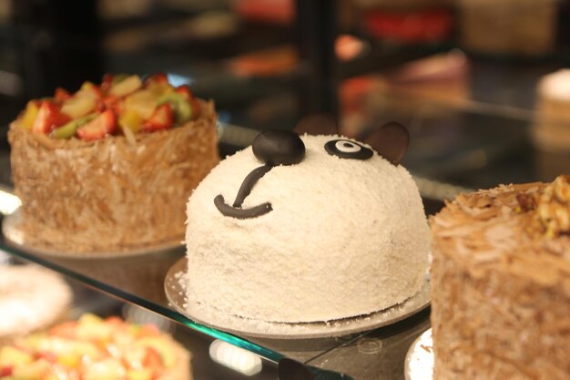 Board with delicious cake on table