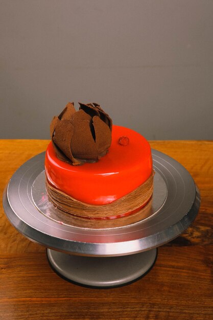 Board with delicious cake on table