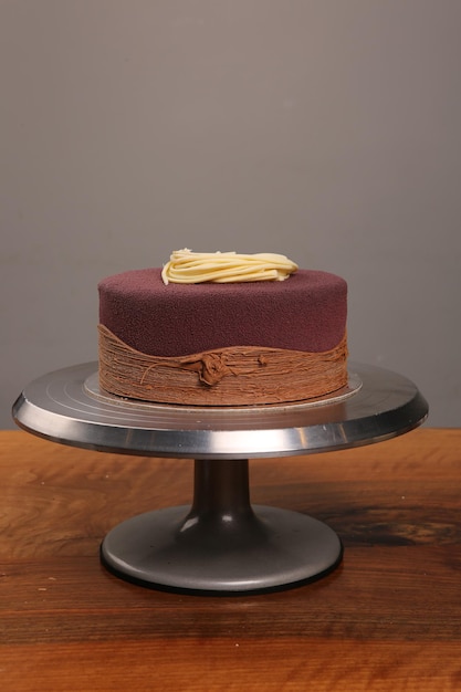 board with delicious cake on table