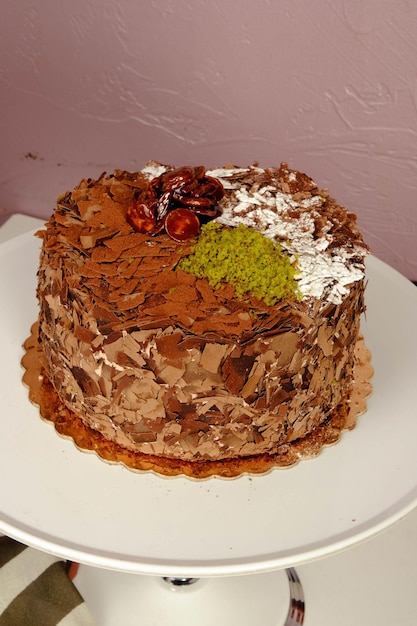 Board with delicious cake on table