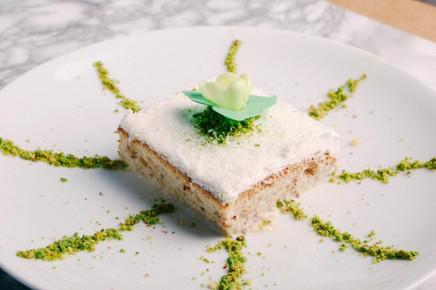 Board with delicious cake on table