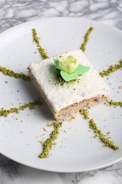 Board with delicious cake on table