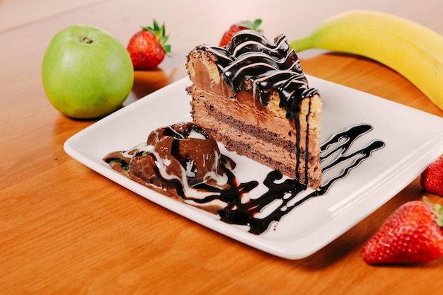 Board with delicious cake on table