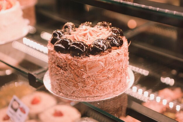 Board with delicious cake on table