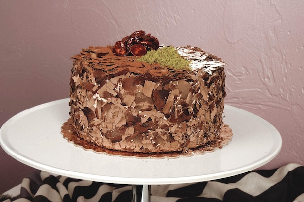 Board with delicious cake on table