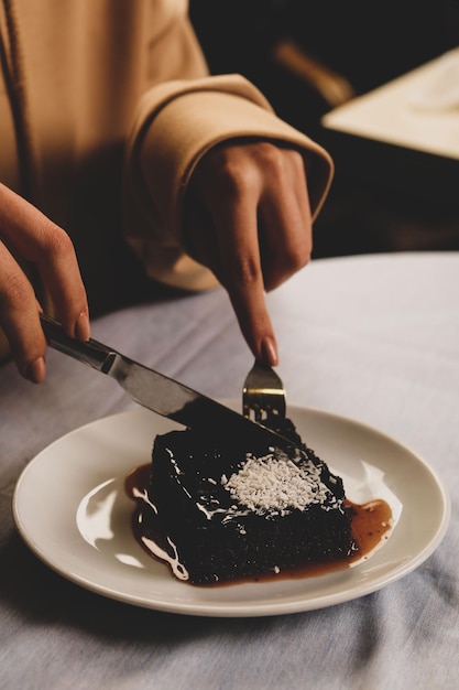 Board with delicious cake on table