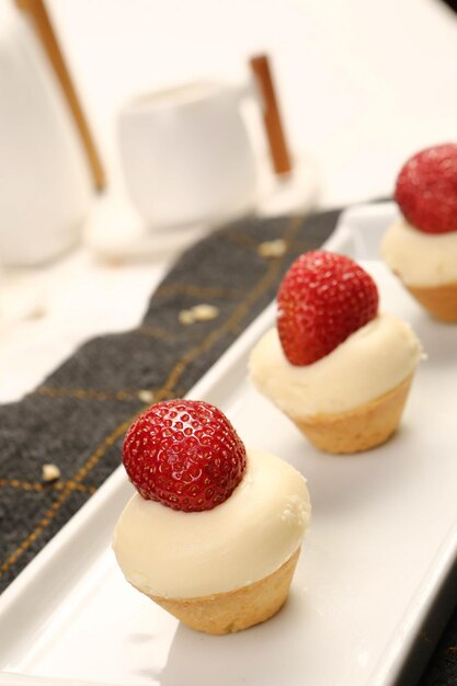 Board with delicious cake on table