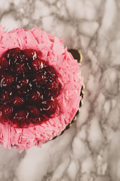 Board with delicious cake on table