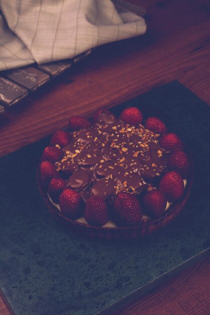 Board with delicious cake on table