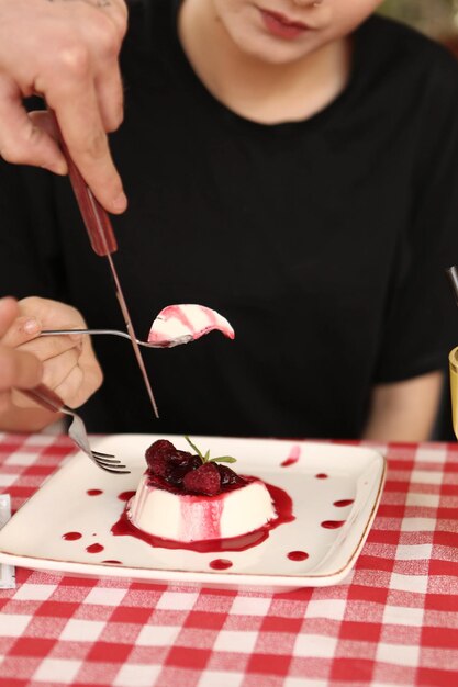 Board with delicious cake on table