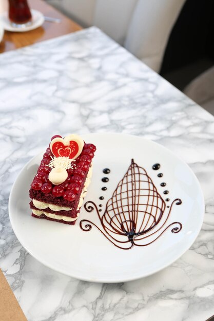 Board with delicious cake on table