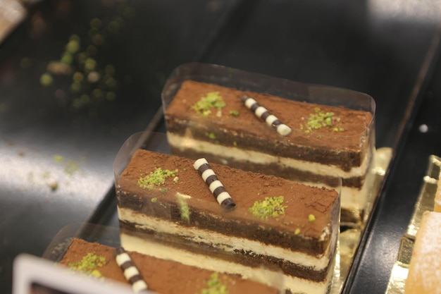 Board with delicious cake on table