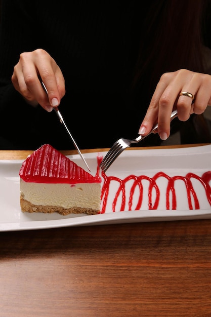 Board with delicious cake on table