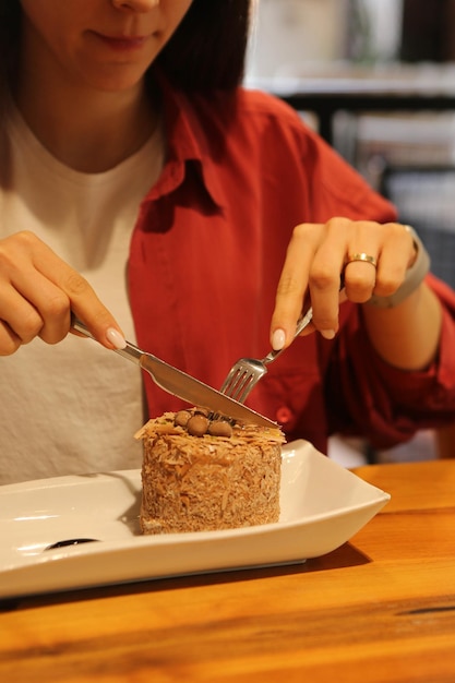 Board with delicious cake on table