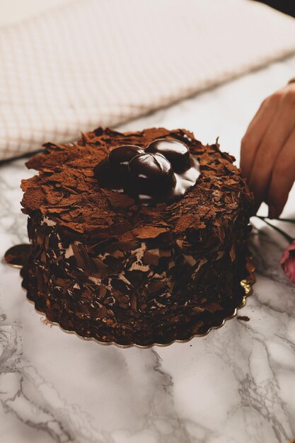 Board with delicious cake on table