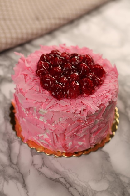 Board with delicious cake on table