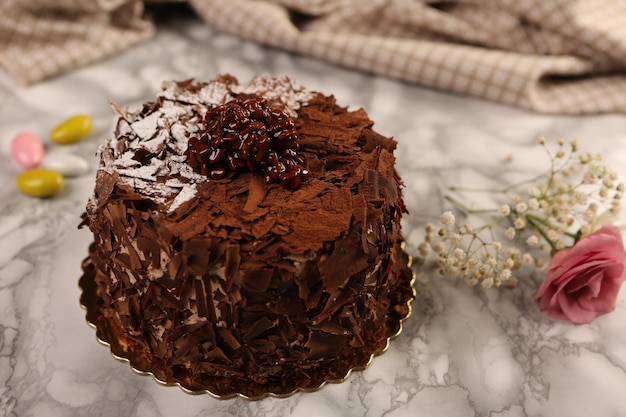 Board with delicious cake on table