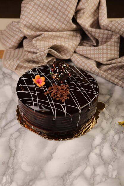 Board with delicious cake on table