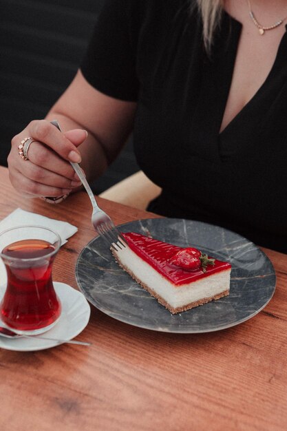 Board with delicious cake on table