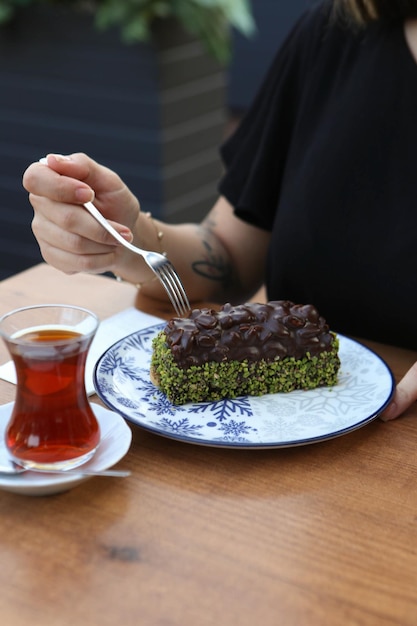 Board with delicious cake on table