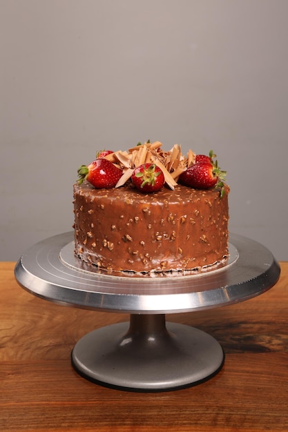 Board with delicious cake on table