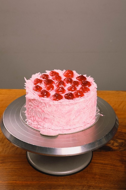 Board with delicious cake on table