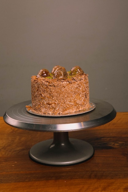 Photo board with delicious cake on table