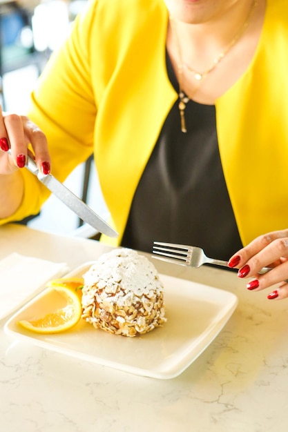 Board with delicious cake on table