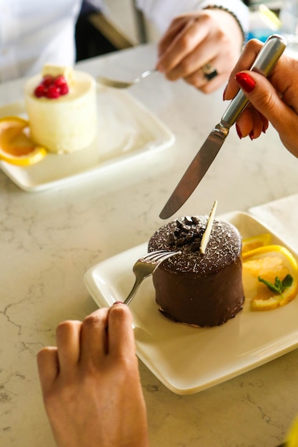 Board with delicious cake on table