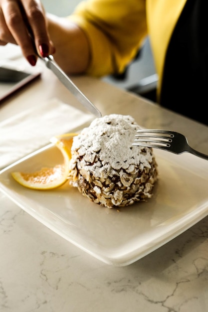 Board with delicious cake on table