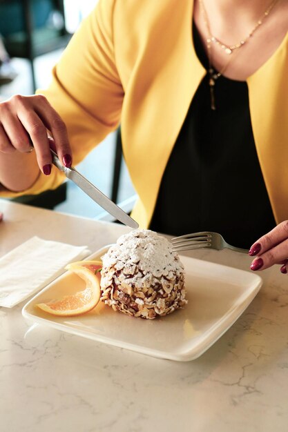 Board with delicious cake on table