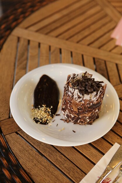 Board with delicious cake on table