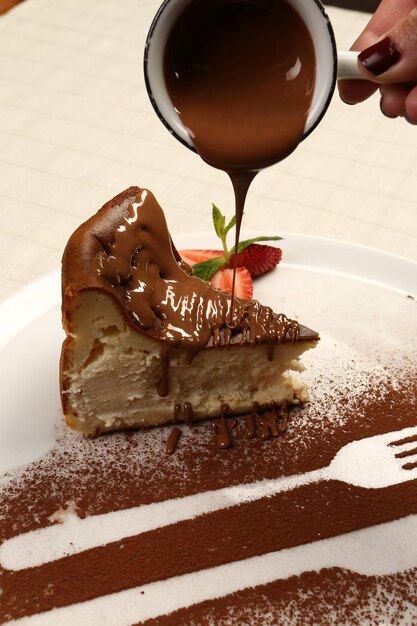 Board with delicious cake on table