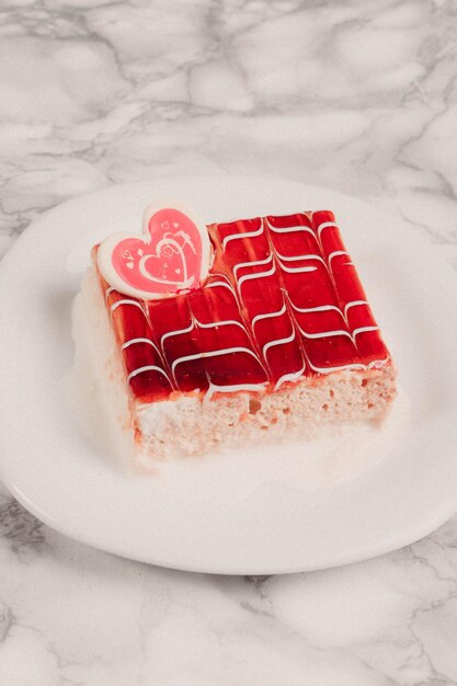 Board with delicious cake on table