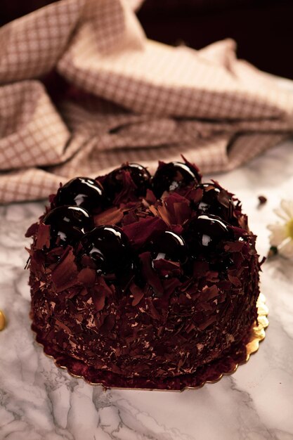 Board with delicious cake on table