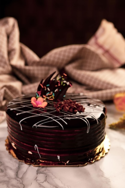 Board with delicious cake on table