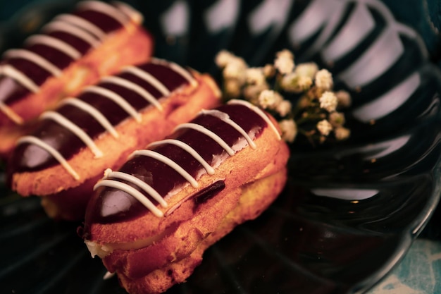 Board with delicious cake on table